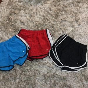 three pairs of nike dri-fit shorts